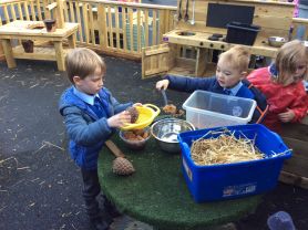P1love playing in the mud kitchen!